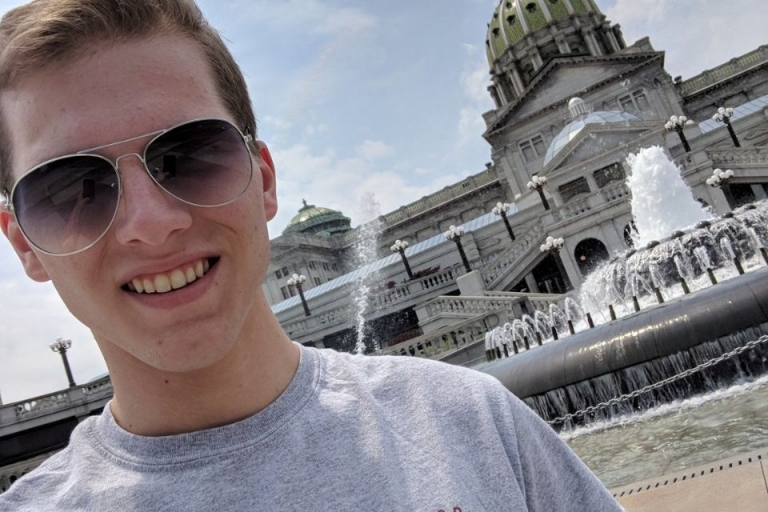 Justin Dickerson near the steps of the PA state capital building
