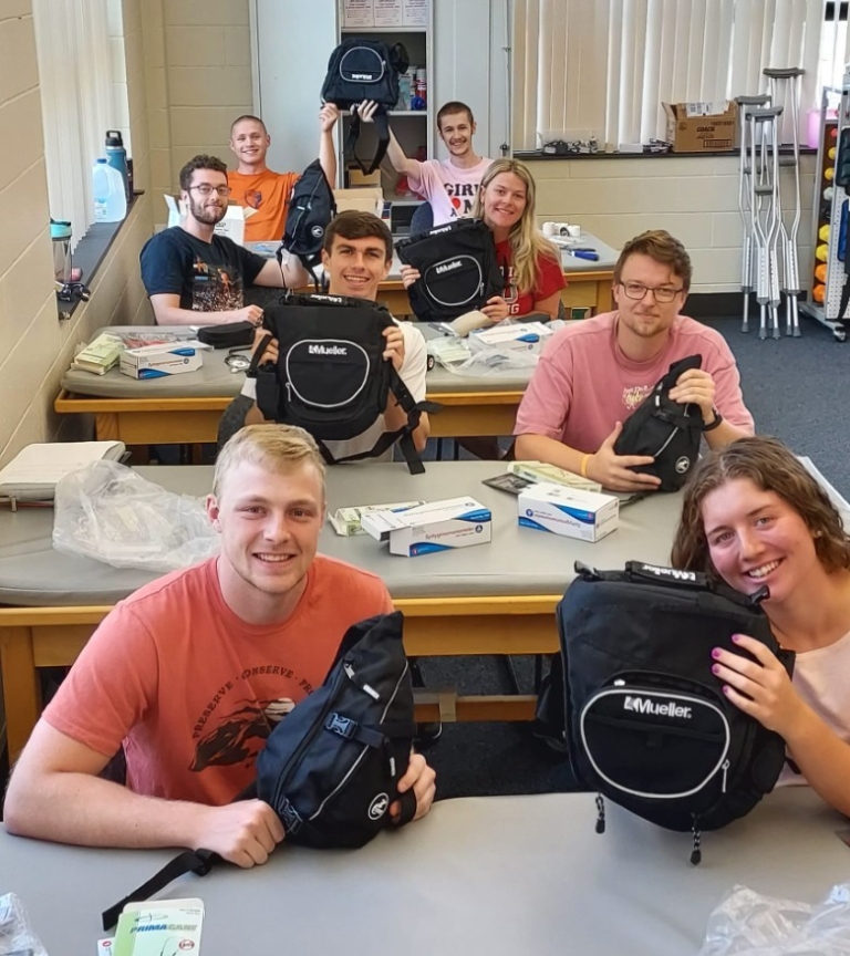 MS Athletic Training students holding their new back backs.jpg