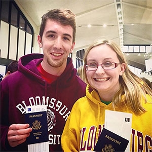 Honors College students with their passports before departing on a study abroad trip.