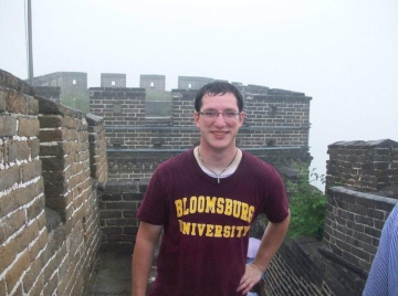 Albertson at the Great Wall of China during a study abroad trip in 2012