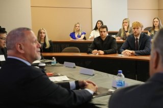 Alumnus Rich Wisniewski speaks to a classroom of students during the annual ZIPD Conference