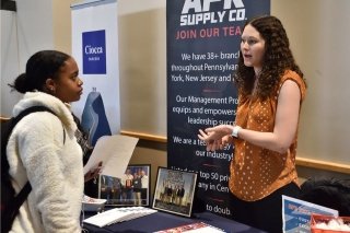 Paige Bohn of APR Supply speaks to a student at a recent career expo