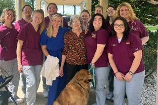 Janice Foust with various students and faculty mentor from the Breiner School of Nursing.