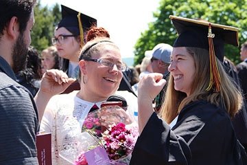 Graduate celebrates with family at spring commencement 