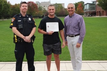 Alan Bergey with officer Eagan (L) and Dean of Students Scott Kane (R)