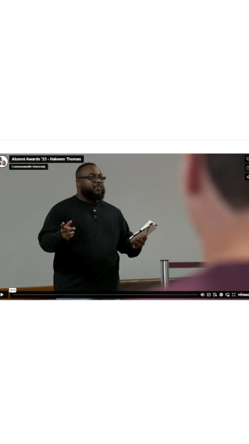 Screenshot of the video title slide showign Hakeem Thomas '18 speaking to a room of students