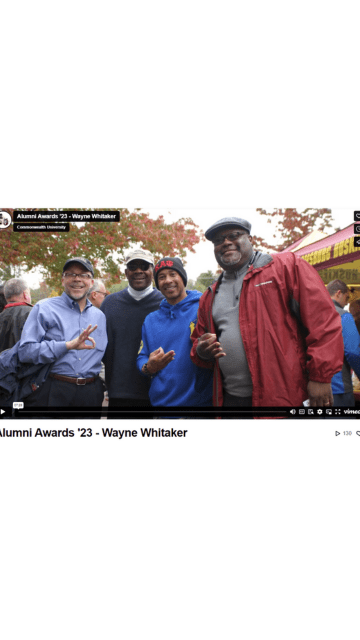 Screenshot of the video title slide showign Wayne Whitaker (far right) with three other men at a recent Homecoming celebration.