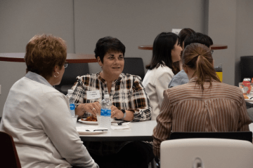 Jennifer Daddario speaks to a student during a networking lunch at a recent Career Intensive Boot Camp