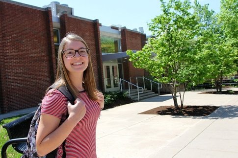 Emily Reynolds poses in front of Hartline Science Center