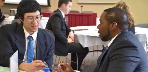 A BU student meets with an employer partner during the Career Intensive Boot Camp as part of BU's commitment to Professional U.
