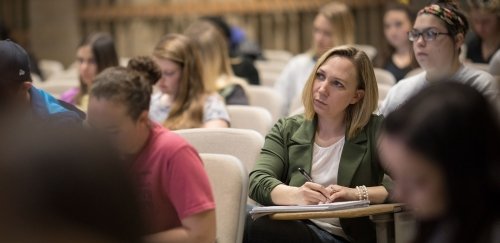 Interdisciplinary major takes notes during her psychology lecture in McCormick Center
