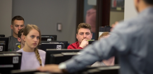 Finance majors listen intently to a lecture in their financial planning class