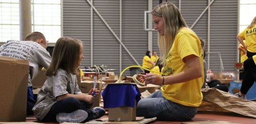 Education major interacts with little girl during the annual Pop-Up Playground event at the Student Rec Center