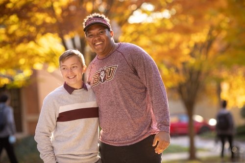 students smiling during the fall