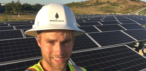 Engineering graduate shows off his solar array work site