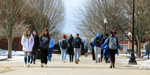 Students walking between classes on lower campus one February morning