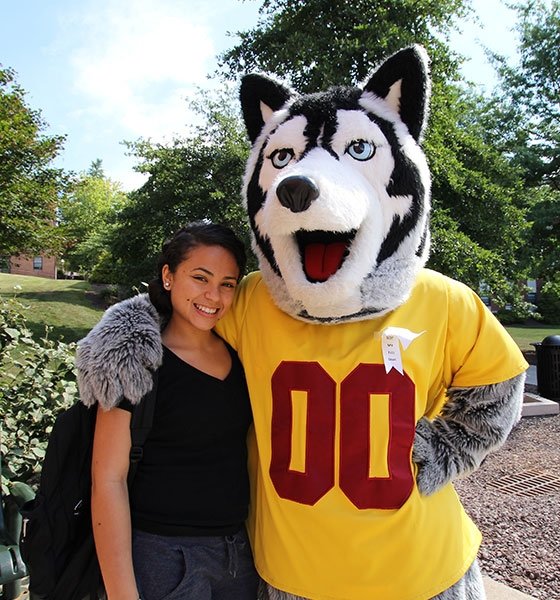 BU's mascot Roongo with a female student on campus.