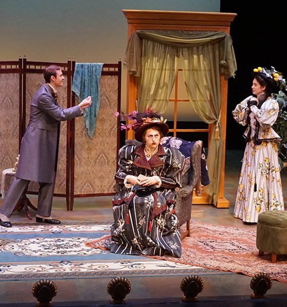 Theatre majors perform on stage in a scene of The Importance of Being Earnest