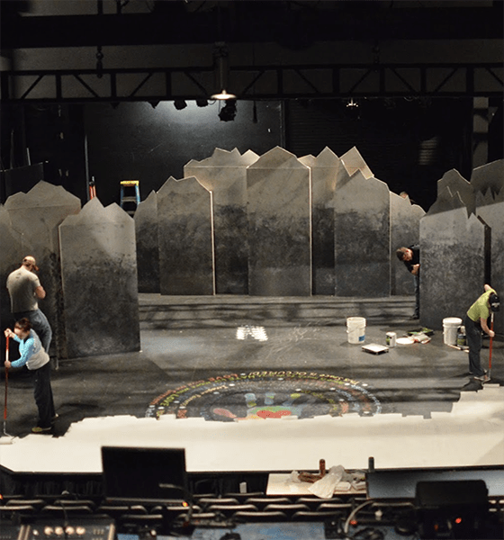 Stage crew preps stage for upcoming theatre performance 