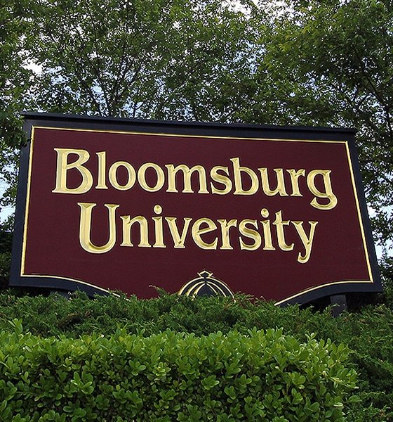 Bloomsburg University welcome sign behind Waller Administration Building