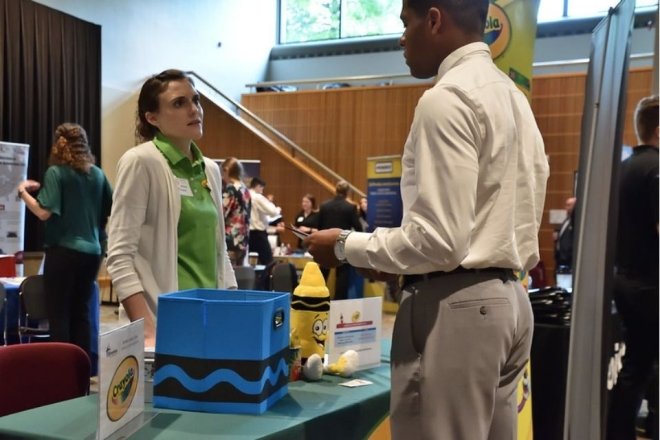 Employer of the Month, Rachel Jerant from Crayola speaks with a student at a recent Career Expo