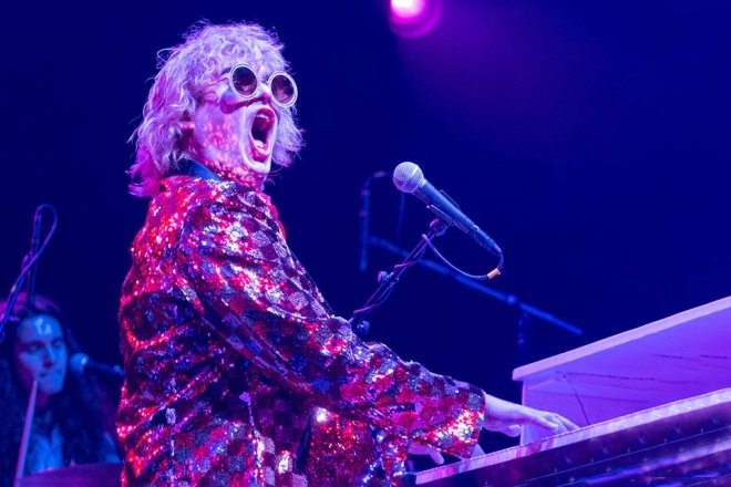 Elton John impersonator playing the piano